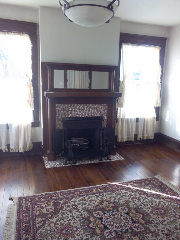 Cast iron fireplace insert featured at KentSuites