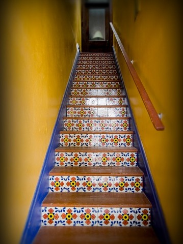 Mexican tiles adorn the stairway leading to the "Treehouse" at KentSuites